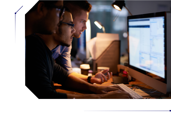 Three men troubleshooting an issue in a computer